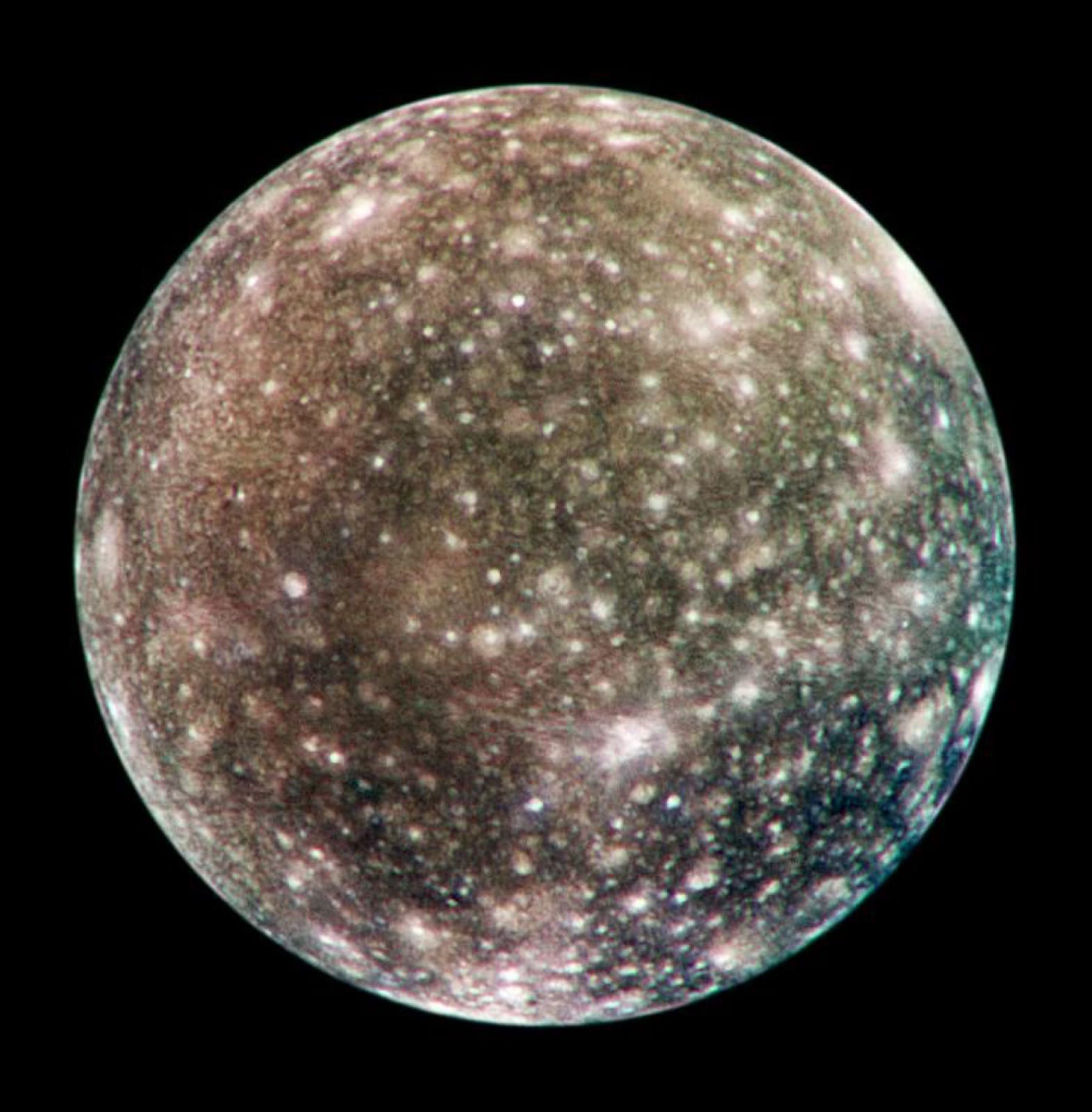 Color Galileo mosaic of dark Callisto covered by bright impact scars and multi-ring basins.