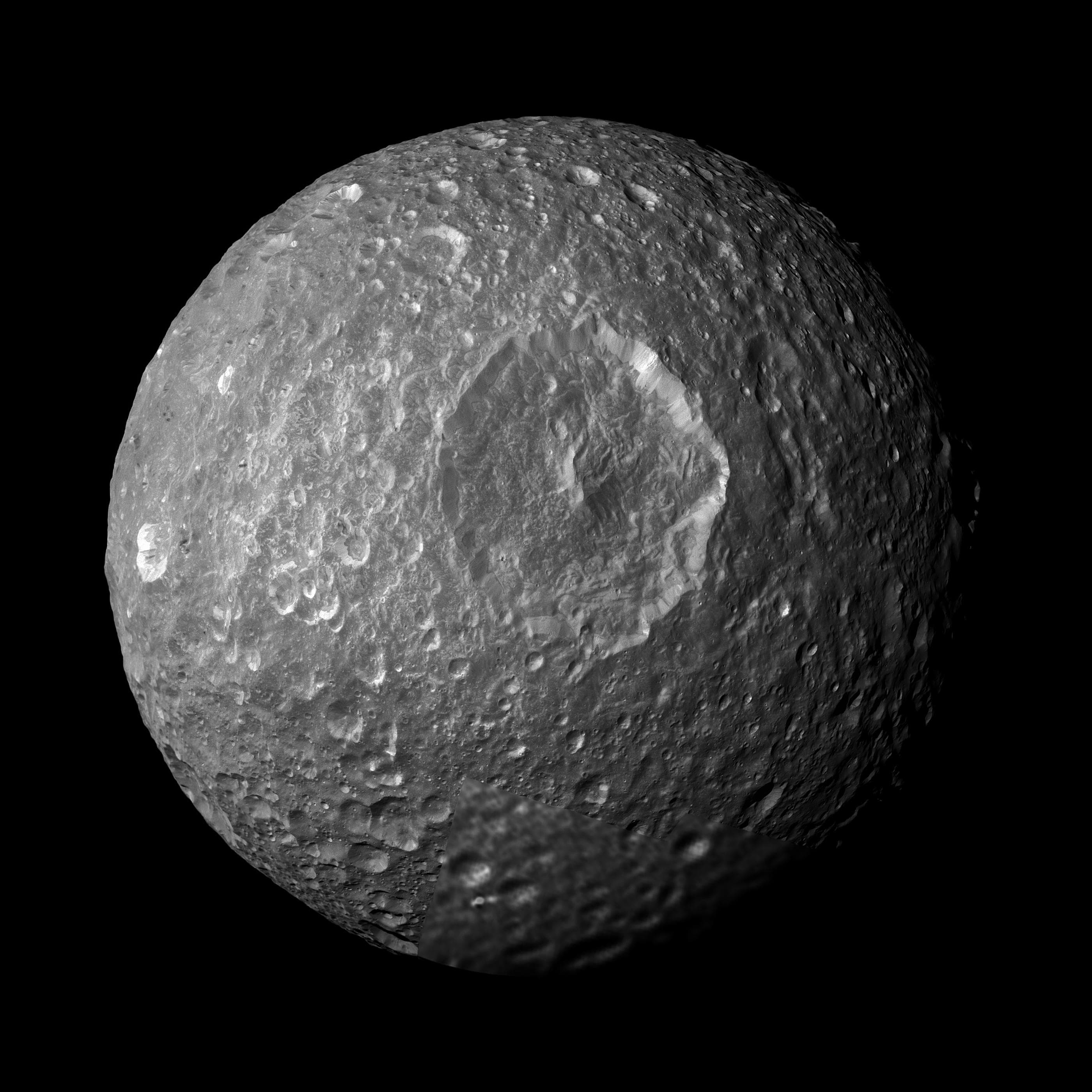 Cassini grayscale mosaic of Mimas with the giant Herschel crater dominating the visible hemisphere.
