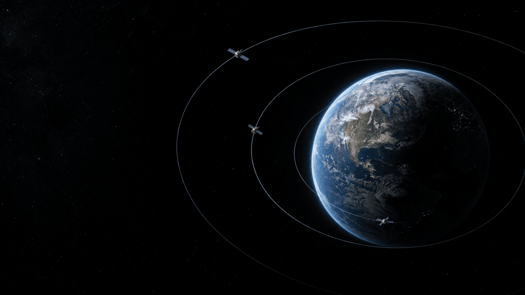 Earth surrounded by three nested circular paths with spacecraft at low, medium, and high altitude.